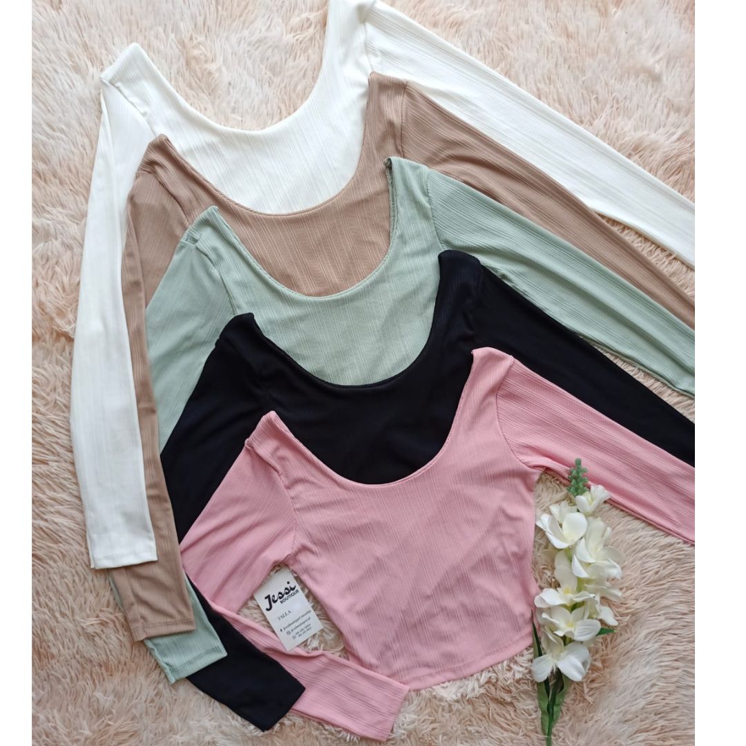 Top manga larga rib acanalado reversible con doble tela. Escote redondo y cruzado. Disponible en 5 colores. Jessi Boutique.